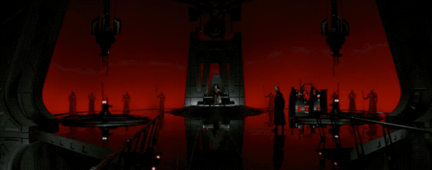 The next interesting new bit includes this wide shot of Supreme Leader Snoke, who gets in the line "Darkness rises...and light to meet it," which may or may not have made me very emotional.
