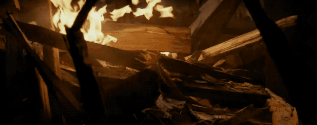 We then have a shot of what appears to be Luke, buried in wooden rubble, breaking out, before he sees what is (presumably) the Jedi Temple on fire.