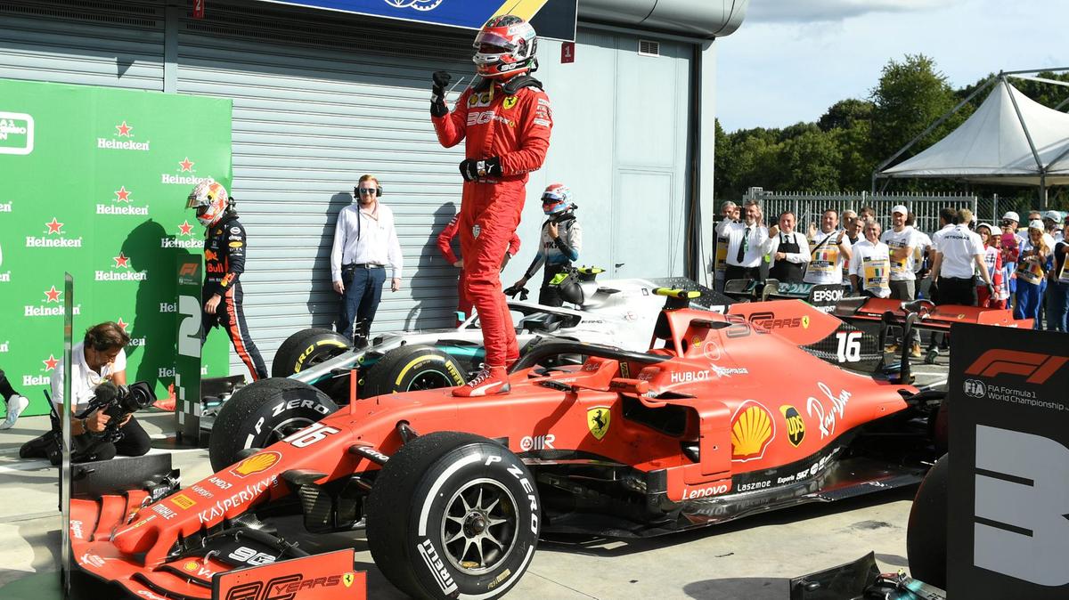 Charles Leclerc stands atop his race-winning Ferrari F1 car at Monza 2019