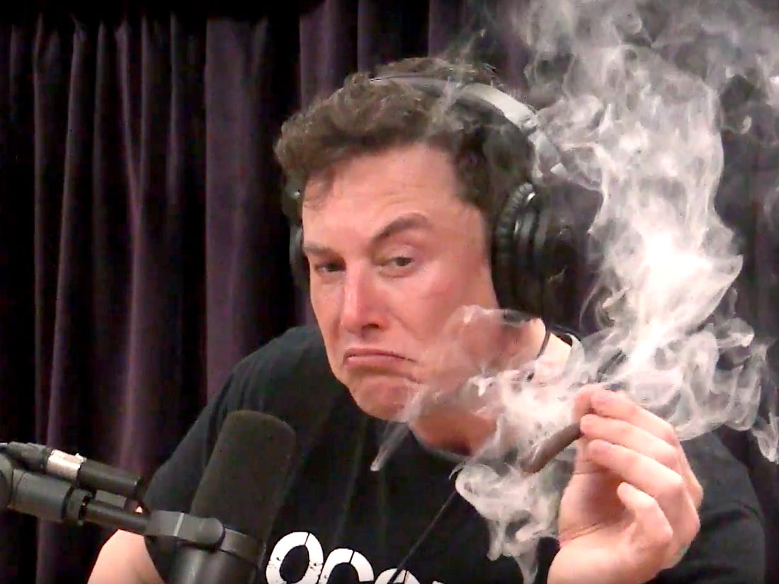 Elon Musk smokes a joint with Joe Rogan.