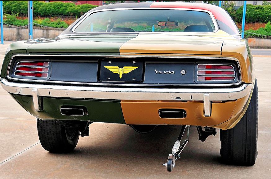Rear view of the Paint Chip Cuda showing its mismatched tires. One side has a drag slick and one side has a normal road tire.