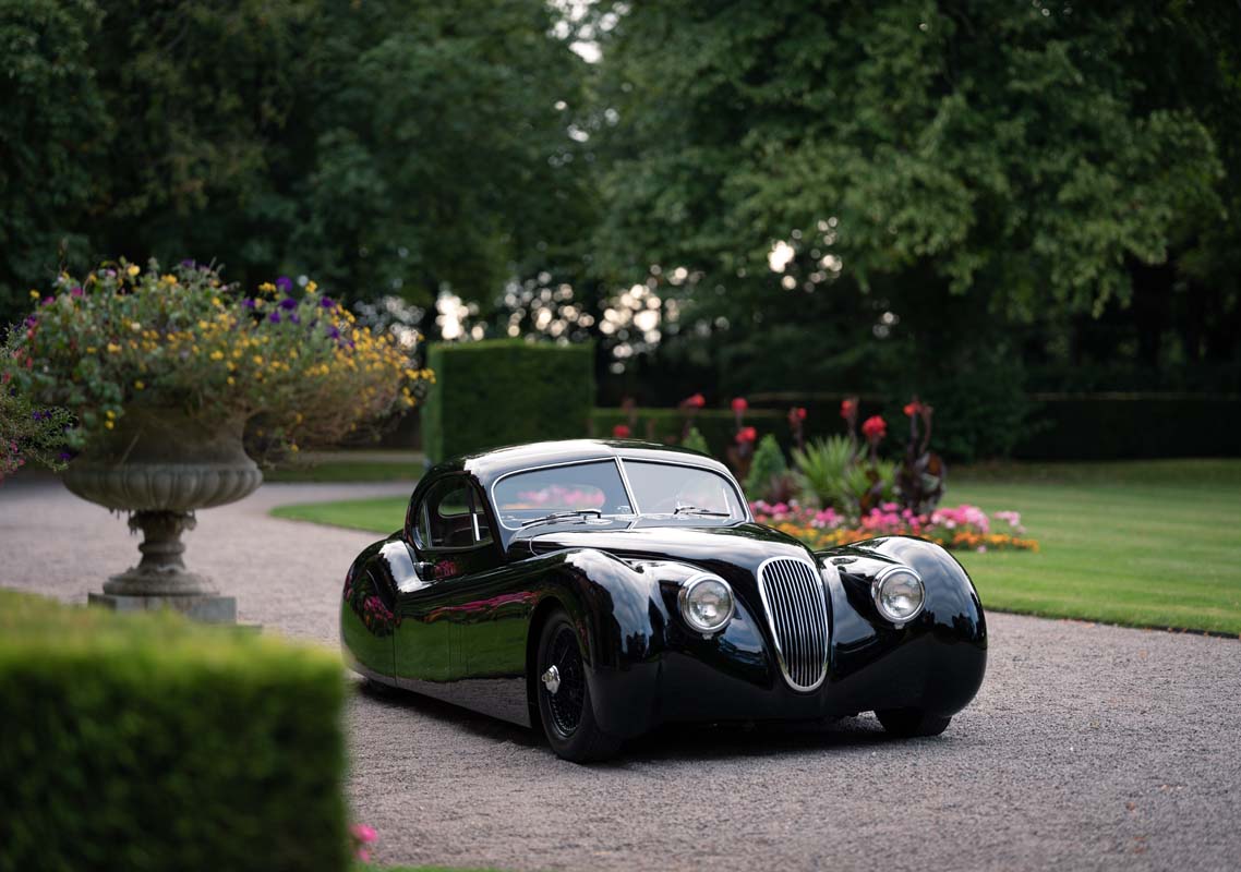 Front three-quarter view of the XK120 LM in the grounds at