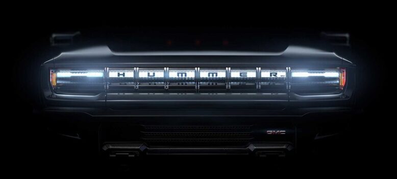 The new electric Hummer's light-bar grille.|A very gaudily-modified Hummer H2. A bad car made much